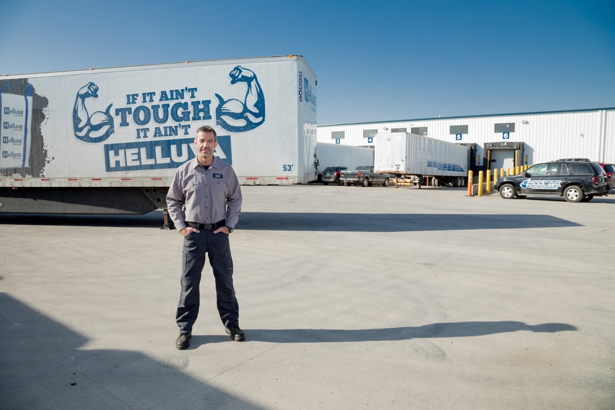 Man in front of semi trailers